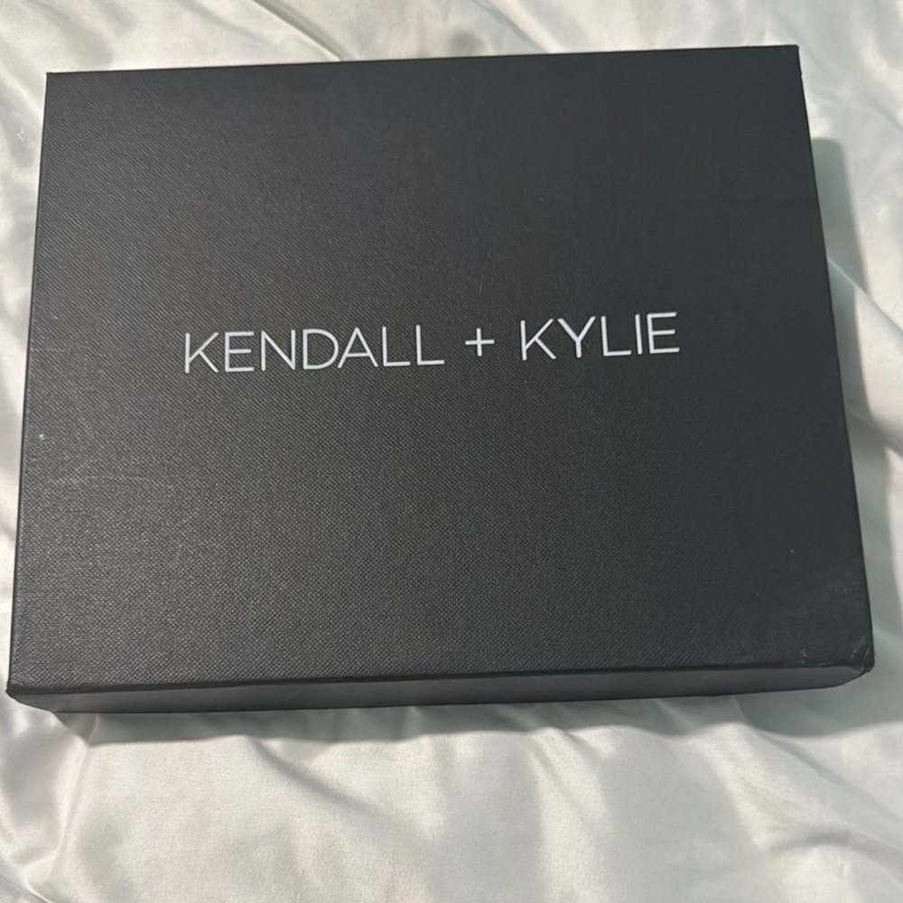 Black high heeled sandal by Kendall and Kylie. Genuine black suede size